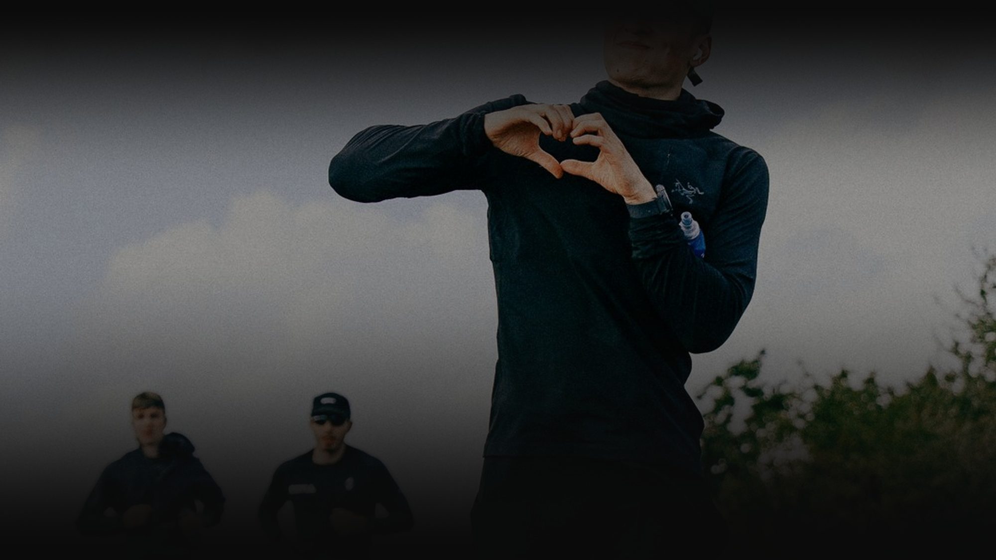 Kim Gottwald making a heart with his hands after a run